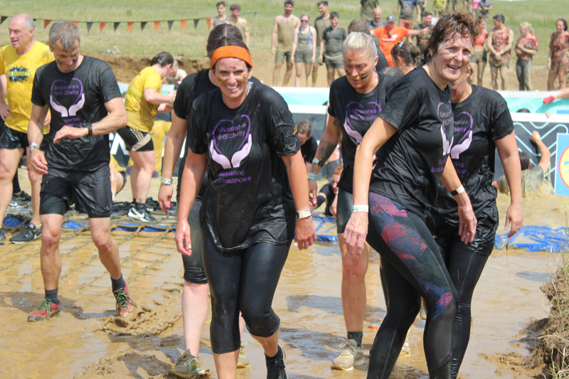 Staff at Tough Mudder event wearing Lincolnshire NHS Charity branded t-shirts
