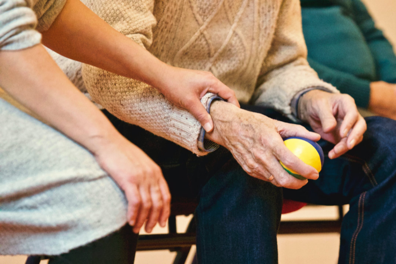 Elderly person being comforted